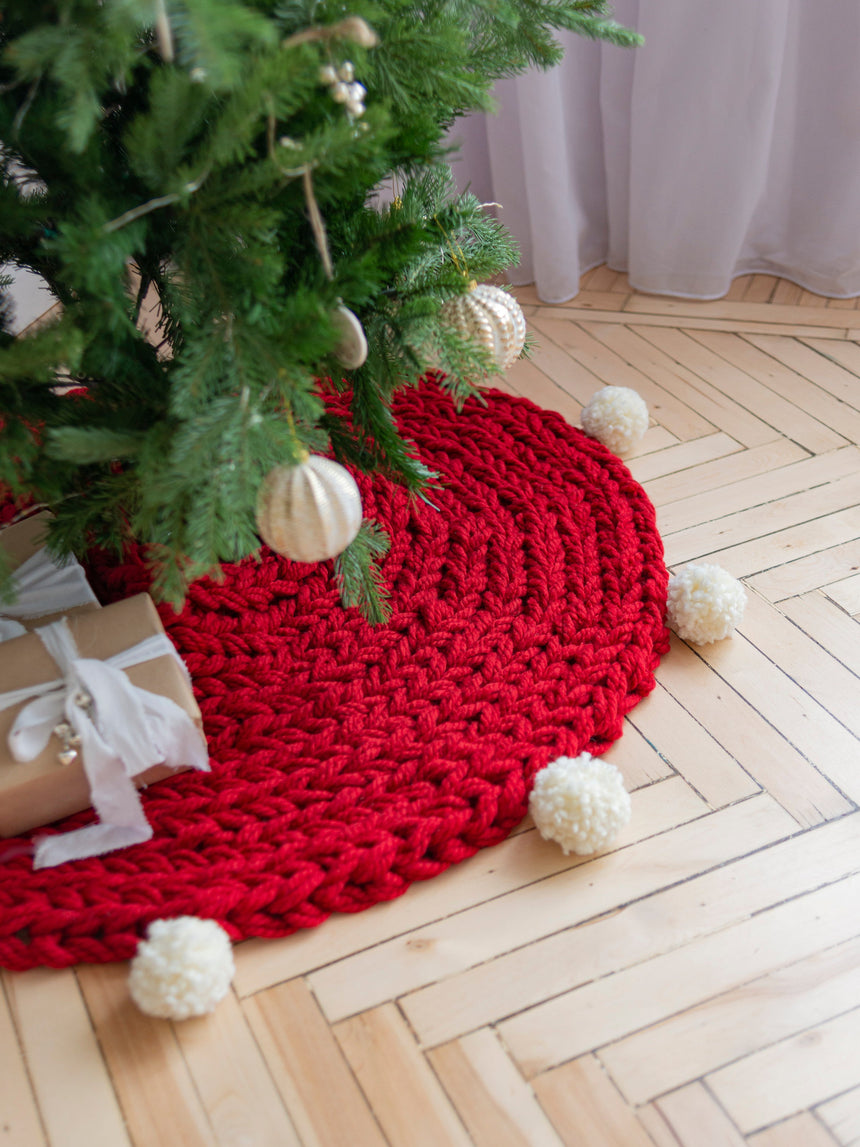 Red hand-knitted Christmas tree skirt